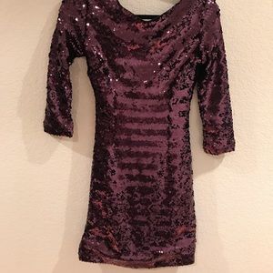 Woman’s purple sequin dress